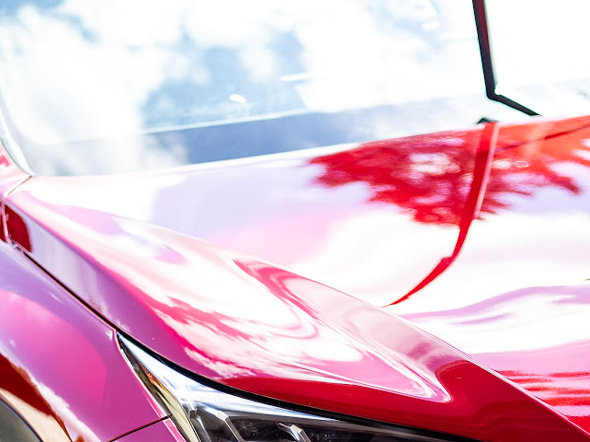 Car paint polished to a deep mirror gloss